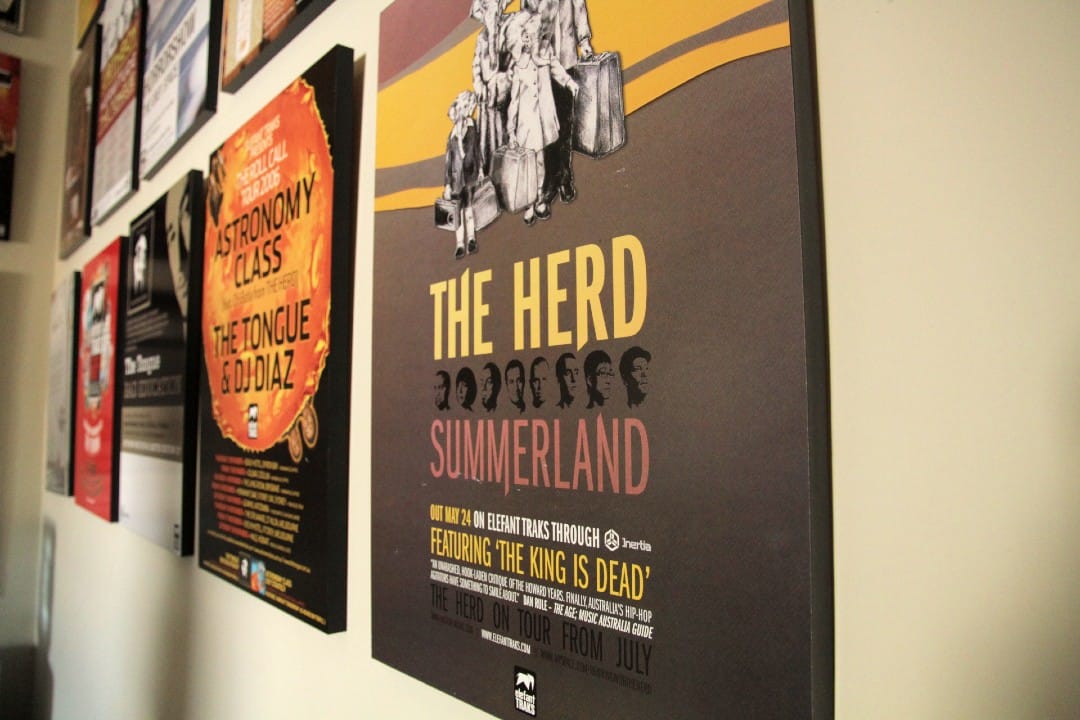 Old gig posters line all of the office walls.